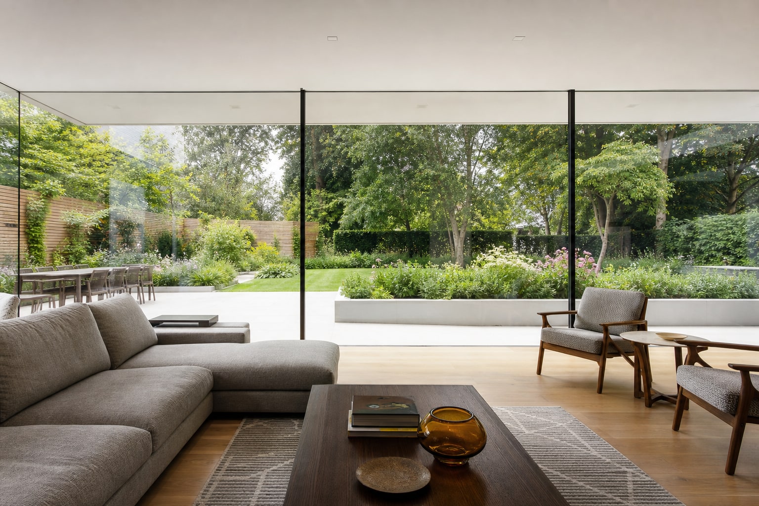 Floor-to-ceiling structural glass wall in a Harpenden living room